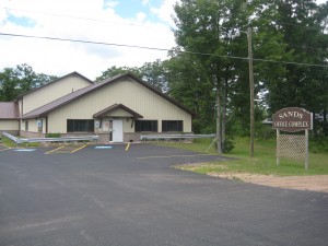 Sandy Office Complex building exterior with parking lot.