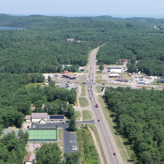 Aerial view of a forested area with a road.